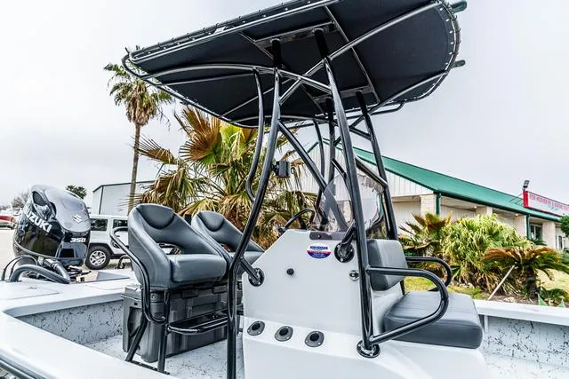 Slide: The Image of 2024 Majek Boats 25 XTREME with T-top and dual seats, featuring Suzuki engine. - 10