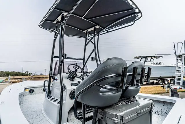 Slide: The Image of 2024 Majek Boats 25 XTREME with T-top and dual seats, showcasing sleek design. - 3