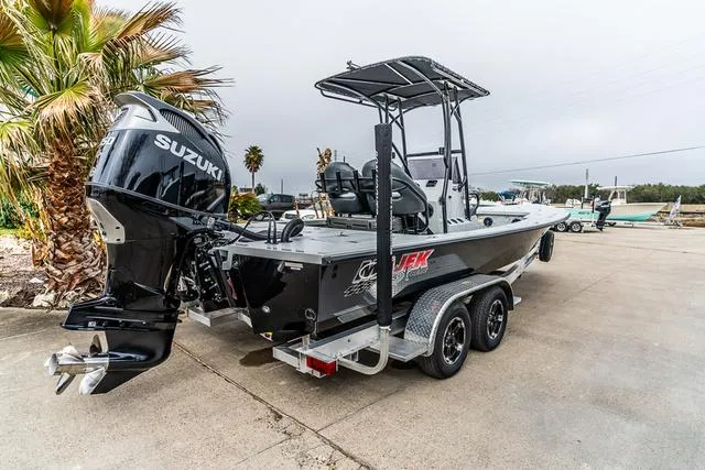 Slide: The Image of 2024 Majek Boats 25 XTREME with Suzuki outboard engine on a trailer. - 6