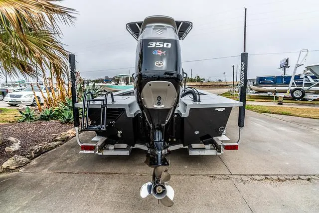 Slide: The Image of 2024 Majek Boats 25 XTREME with powerful 350 engine, rear view on trailer. - 7