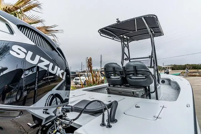 Slide: The Image of 2024 Majek Boats 25 XTREME with Suzuki engine, featuring dual seats and canopy. - 8