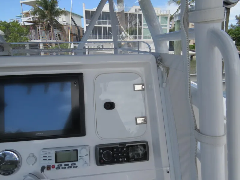 Slide: The Image of Control panel of a 2015 Invincible 42 Open Fisherman boat with navigation equipment. - 10