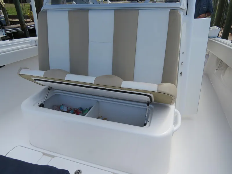 Slide: The Image of 2015 Invincible 42 Open Fisherman boat with open storage compartment under seat. - 19