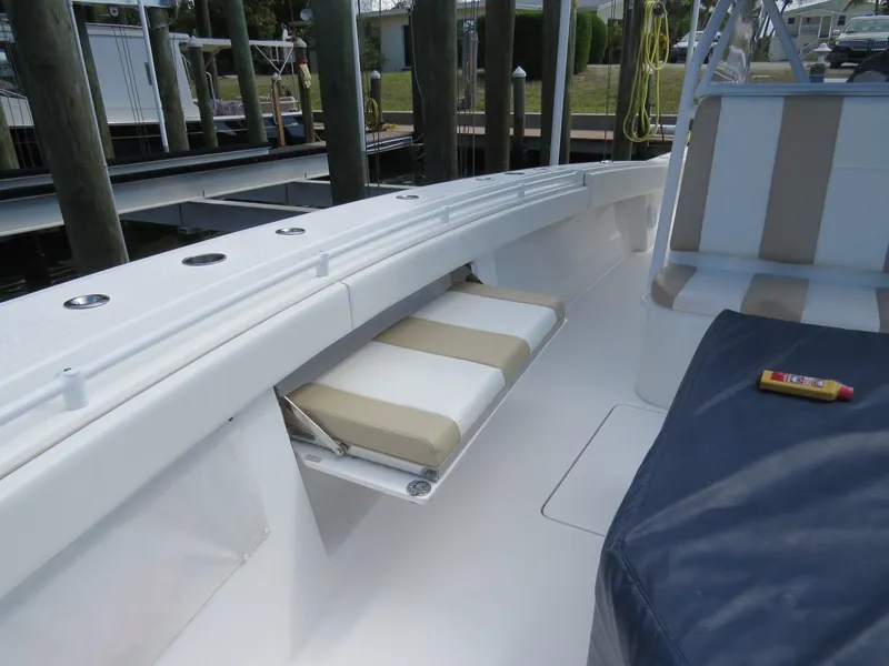 Slide: The Image of 2015 Invincible 42 Open Fisherman boat interior with seating and storage. - 21