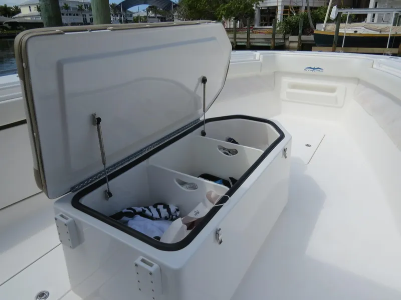 Slide: The Image of Open storage compartment on 2015 Invincible 42 Open Fisherman boat. - 23