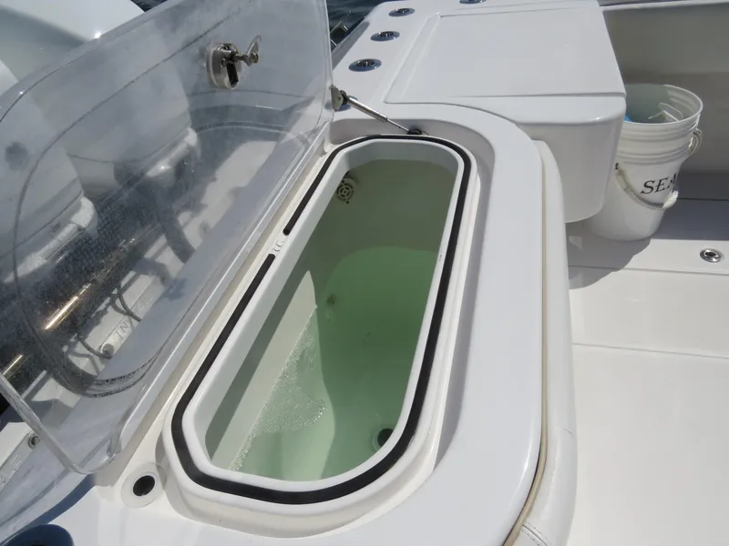 Slide: The Image of Livewell on 2015 Invincible 42 Open Fisherman boat deck. - 37