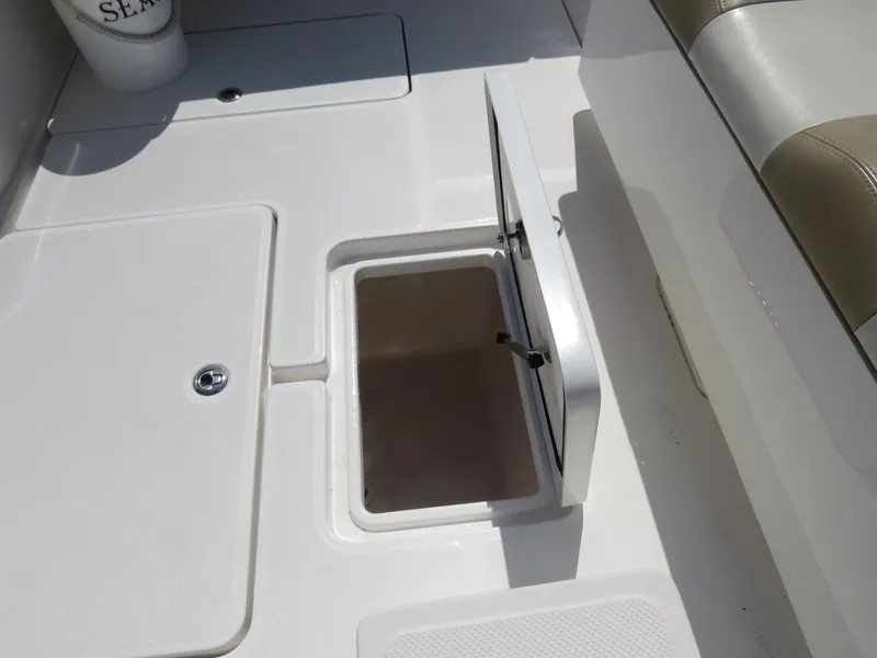 Slide: The Image of 2015 Invincible 42 Open Fisherman boat deck with open storage compartment. - 40