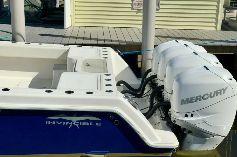Slide: The Image of 2015 Invincible 42 Open Fisherman with Mercury engines docked at a marina. - 5