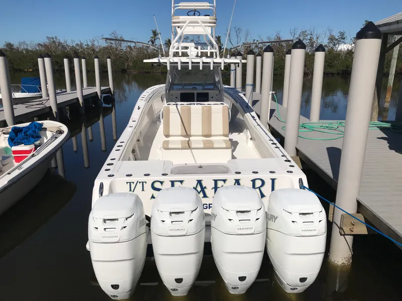 Slide: The Image of 2015 Invincible 42 Open Fisherman boat docked with four outboard engines. - 6