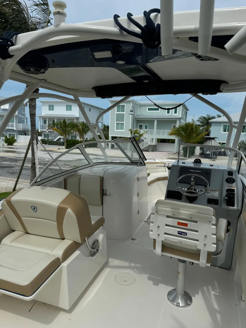Slide: The Image of 2016 Century 24 Resorter boat interior with seating and control panel. - 6