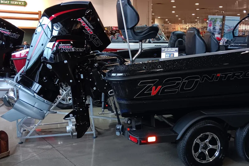 Slide: The Image of 2025 Nitro ZV20 boat with powerful outboard motor displayed indoors. - 3