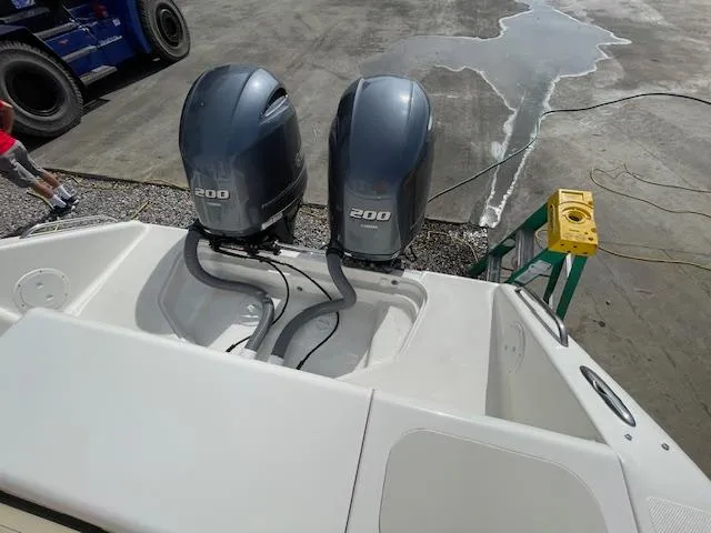 Slide: The Image of 2018 Pursuit 265 DC boat with twin 200 horsepower engines. - 19