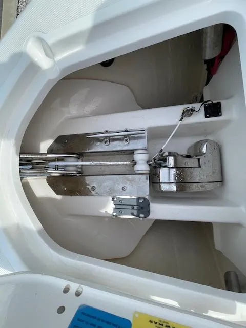 Slide: The Image of Anchor compartment of 2018 Pursuit 265 DC boat, featuring stainless steel hardware. - 44