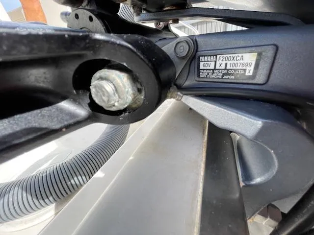 Slide: The Image of Close-up of Yamaha F200XCA engine part on 2018 Pursuit 265 DC boat. - 8