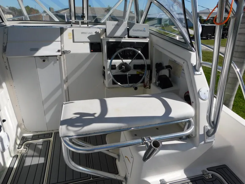 Slide: The Image of 2002 Sport-Craft 272 Sportfish boat helm with Garmin navigation system. - 14