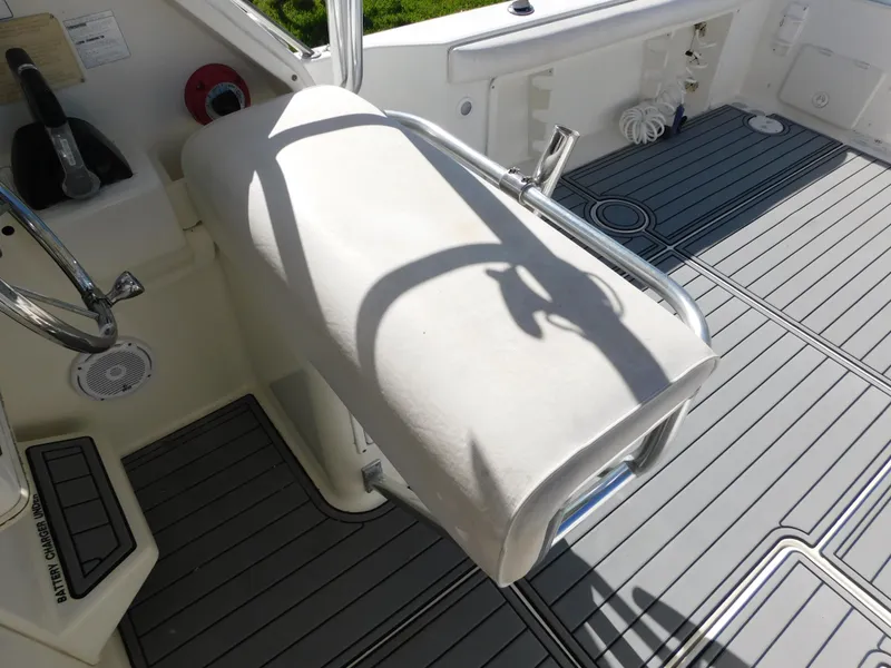 Slide: The Image of Sport-Craft 272 Sportfish 2002 boat interior with cushioned seating and non-slip flooring. - 17
