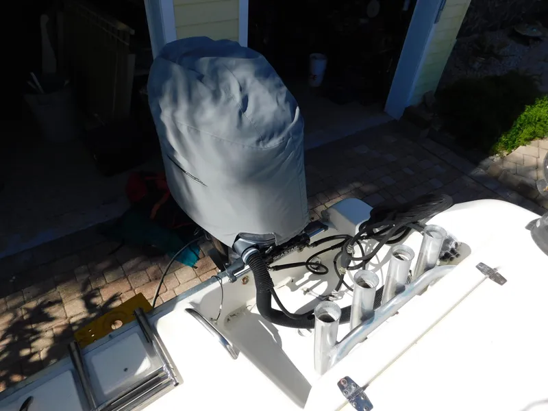 Slide: The Image of Covered outboard motor on 2002 Sport-Craft 272 Sportfish boat with rod holders. - 19