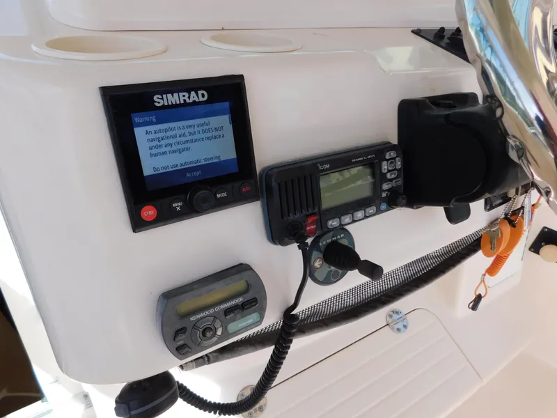 Slide: The Image of Control panel of a 2002 Sport-Craft 272 Sportfish boat with navigation equipment. - 22