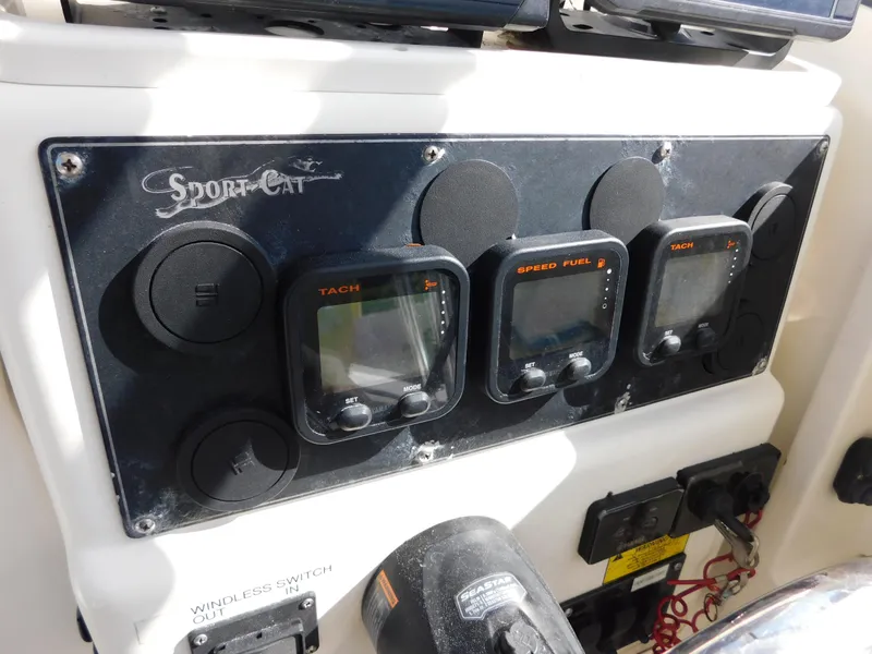 Slide: The Image of Control panel of 2002 Sport-Craft 272 Sportfish boat with gauges and switches. - 24