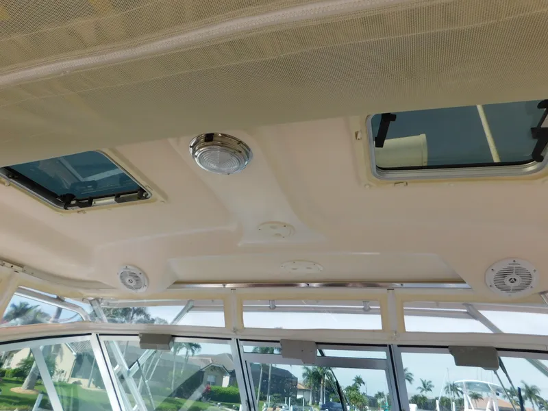Slide: The Image of Interior view of 2002 Sport-Craft 272 Sportfish boat ceiling with hatches and speakers. - 25