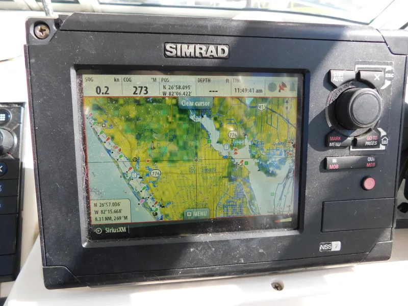Slide: The Image of Simrad GPS navigation system on 2002 Sport-Craft 272 Sportfish boat. - 28