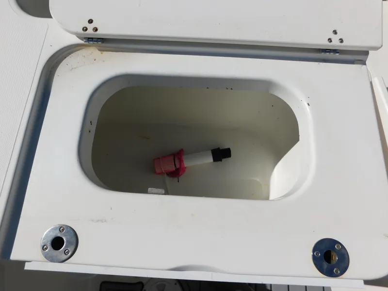 Slide: The Image of Open storage compartment on 2002 Sport-Craft 272 Sportfish boat. - 32