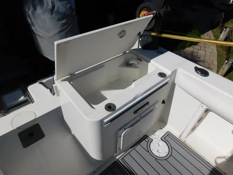 Slide: The Image of Open storage compartment on 2002 Sport-Craft 272 Sportfish boat deck. - 34
