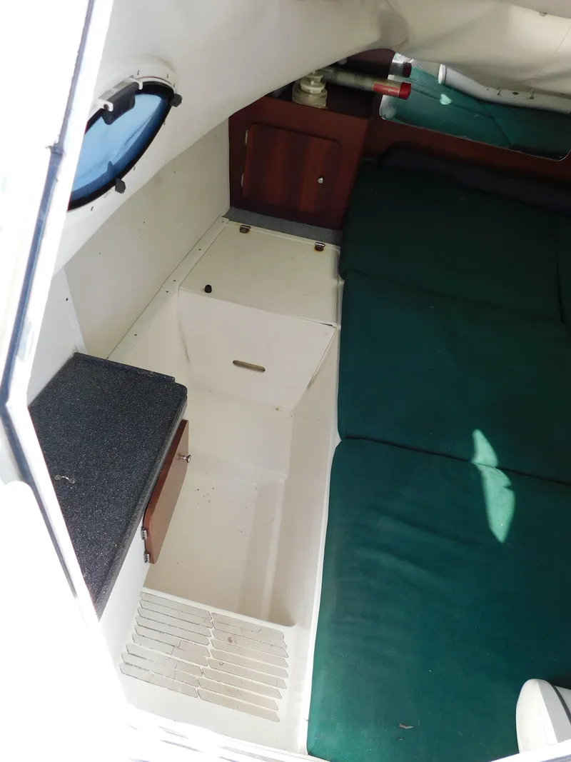 Slide: The Image of Interior cabin of 2002 Sport-Craft 272 Sportfish boat with green cushions. - 37