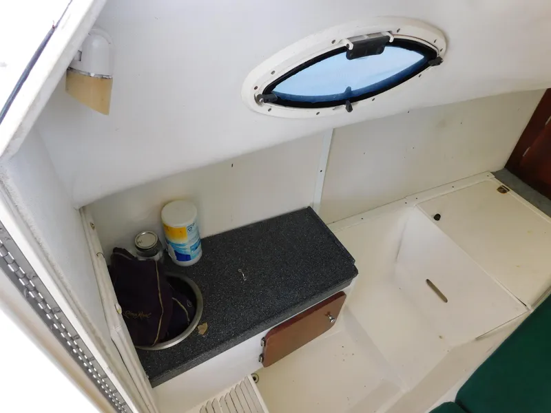 Slide: The Image of Interior of 2002 Sport-Craft 272 Sportfish boat with countertop and porthole. - 38