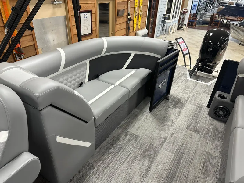 Slide: The Image of 2025 Crest Classic 220 boat interior with gray seating and modern design. - 12