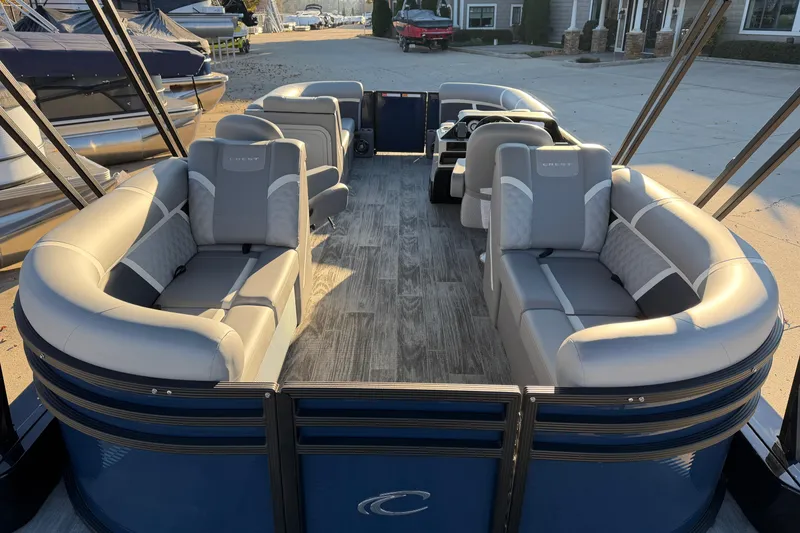 Slide: The Image of 2025 Crest Classic 220 pontoon boat with spacious seating and modern design. - 27