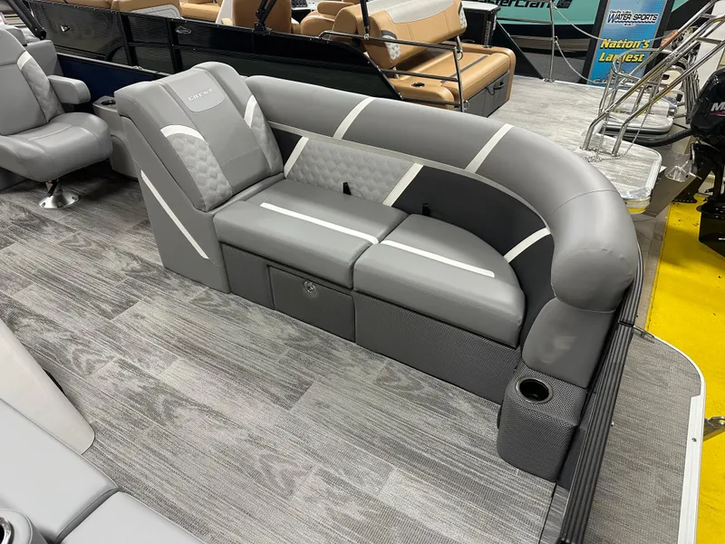 Slide: The Image of 2025 Crest Classic 220 boat interior with gray seating and modern design. - 3