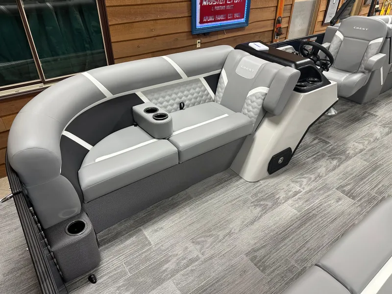 Slide: The Image of 2025 Crest Classic 220 boat interior with gray seating and modern helm. - 4