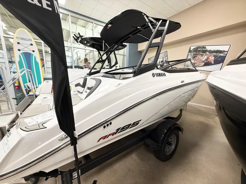 Slide: The Image of 2025 Yamaha Boats AR195 displayed indoors, sleek white design, modern features. - 3