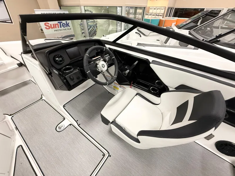 Slide: The Image of 2025 Yamaha Boats AR195 interior with sleek steering wheel and modern dashboard design. - 6