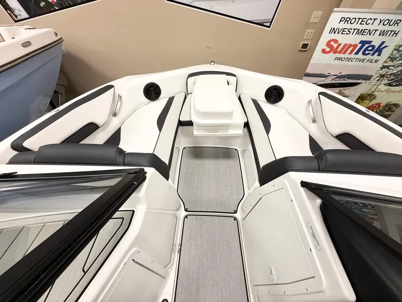 Slide: The Image of 2025 Yamaha Boats AR195 interior with sleek white and black seating, modern design. - 7