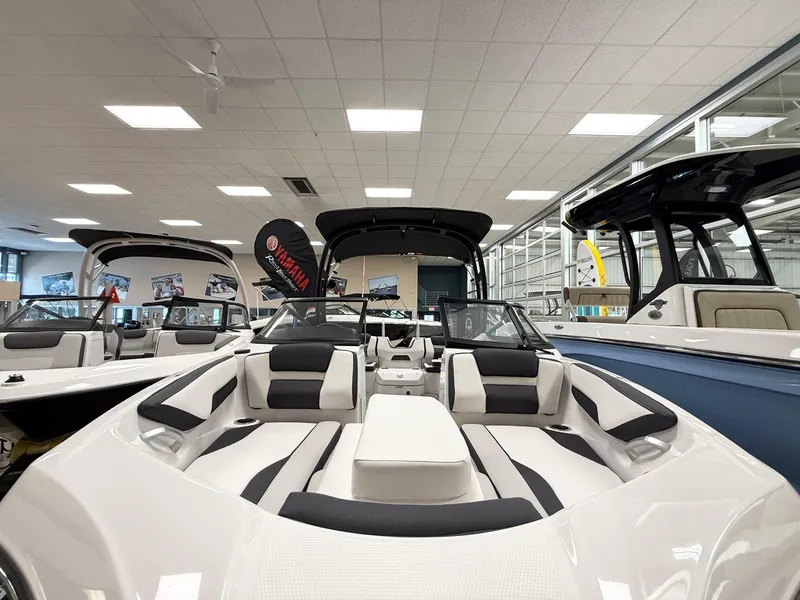 Slide: The Image of 2025 Yamaha Boats AR195 in showroom, featuring sleek design and modern interior. - 9