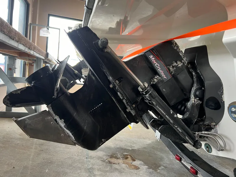 Slide: The Image of Close-up of a 2017 Sea Ray SPX 190 boat's MerCruiser engine and propeller. - 14