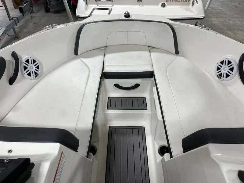 Slide: The Image of 2017 Sea Ray SPX 190 boat interior with white seating and black accents. - 5