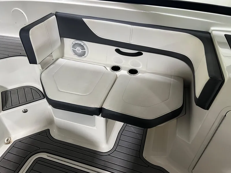 Slide: The Image of 2017 Sea Ray SPX 190 boat seating area with cup holders and speaker. - 6