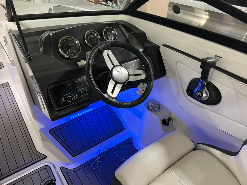 Slide: The Image of Interior of 2017 Sea Ray SPX 190 boat with illuminated dashboard and steering wheel. - 9