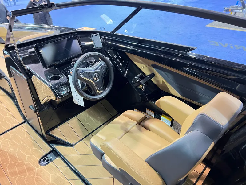 Slide: The Image of Interior of 2025 Yamaha Boats 255XD, featuring modern steering and dashboard design. - 4