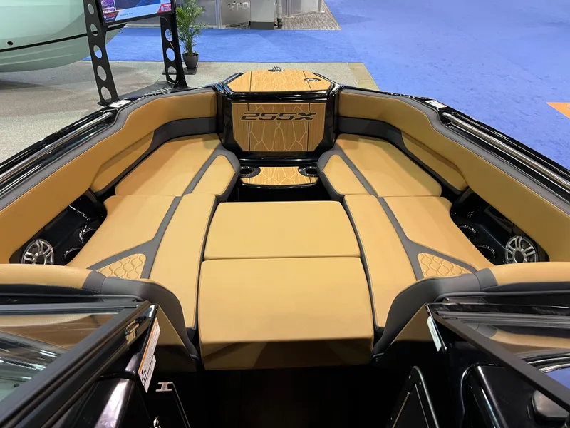 Slide: The Image of 2025 Yamaha Boats 255XD interior with tan seating and modern design. - 8