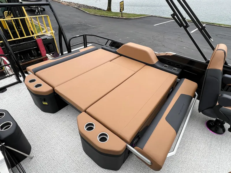 Slide: The Image of Luxurious 2025 South Bay 523 ULE 3.0+ boat interior with tan seating and cup holders. - 13