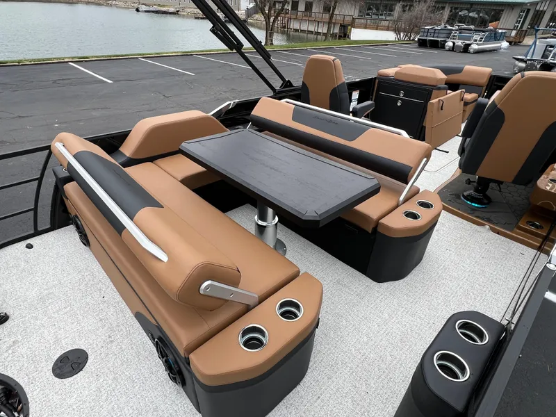 Slide: The Image of Luxurious 2025 South Bay 523 ULE 3.0+ boat interior with tan seating and table. - 14