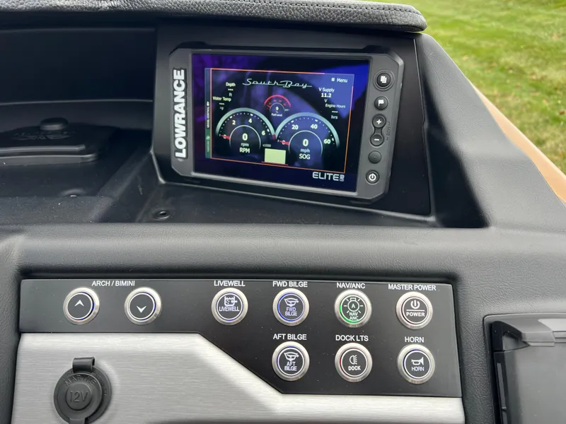 Slide: The Image of Dashboard of 2025 South Bay 523 ULE 3.0+ with Lowrance Elite display and control panel. - 26