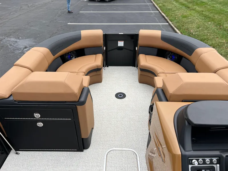 Slide: The Image of Luxurious 2025 South Bay 523 ULE 3.0+ pontoon boat interior with tan and black seating. - 28