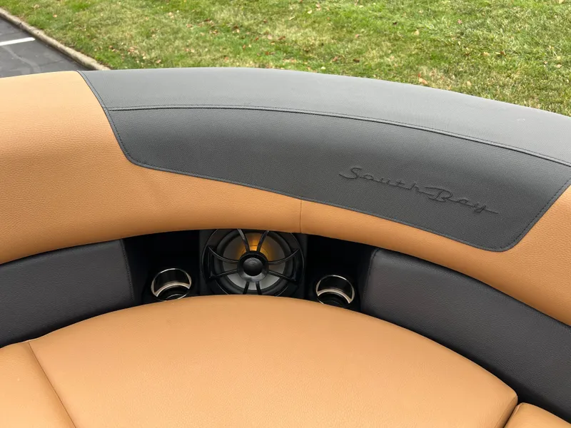Slide: The Image of 2025 South Bay 523 ULE 3.0+ boat interior with tan and gray seating. - 31