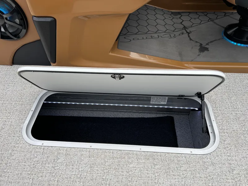 Slide: The Image of Open storage compartment in 2025 South Bay 523 ULE 3.0+ boat interior. - 33