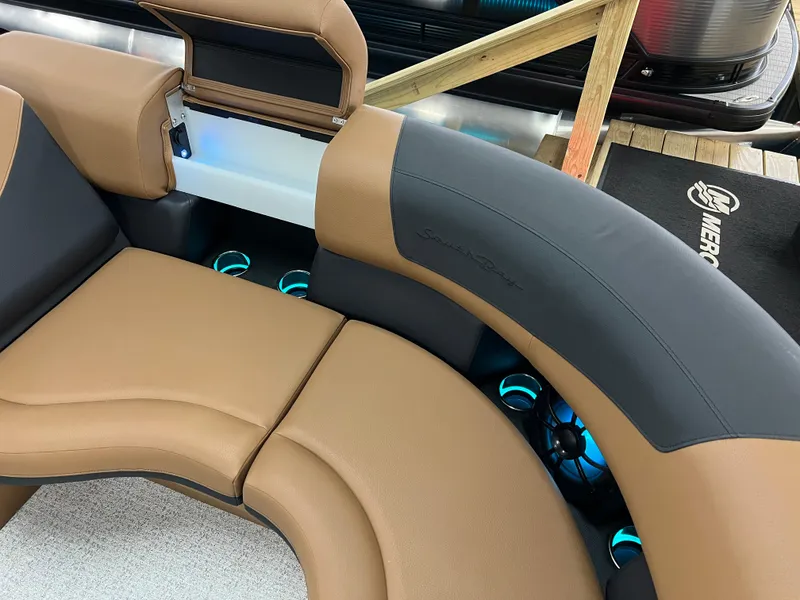 Slide: The Image of Luxurious seating on 2025 South Bay 523 ULE 3.0+ pontoon boat, featuring tan and black upholstery. - 35